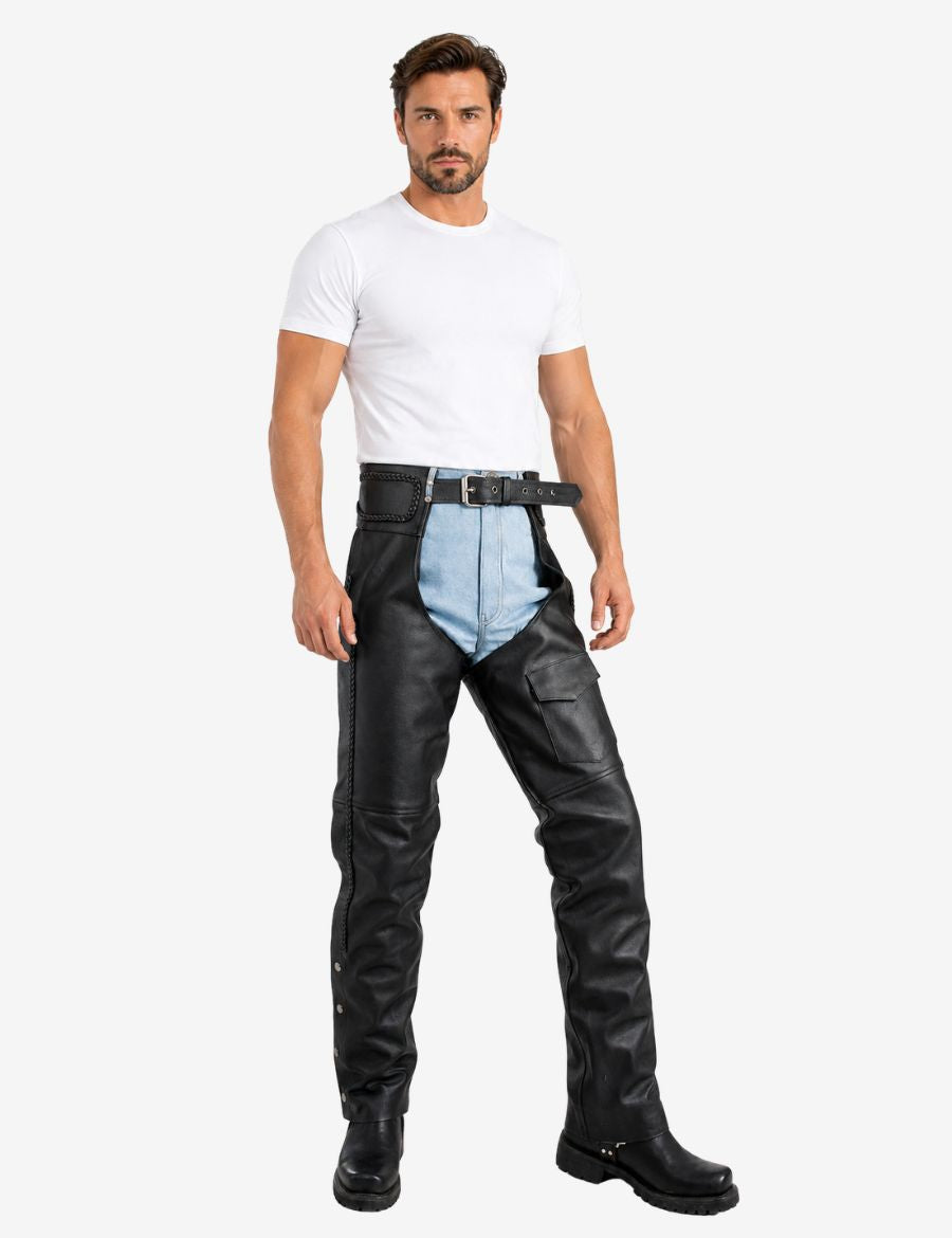 Angled front view of black utility braided leather chaps for men with side braiding and flap Utility pocket.