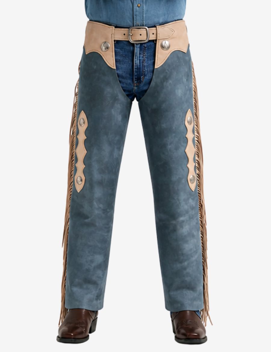 Close-up front view of vintage blue suede cowboy chaps with fringe and silver concho accents.