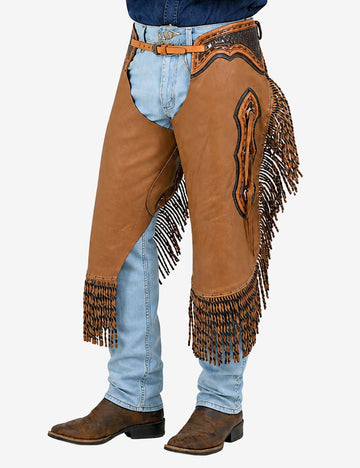 Angled front view of western braided leather chinks chaps with layered fringe, tooling accents, and rugged cowboy design.