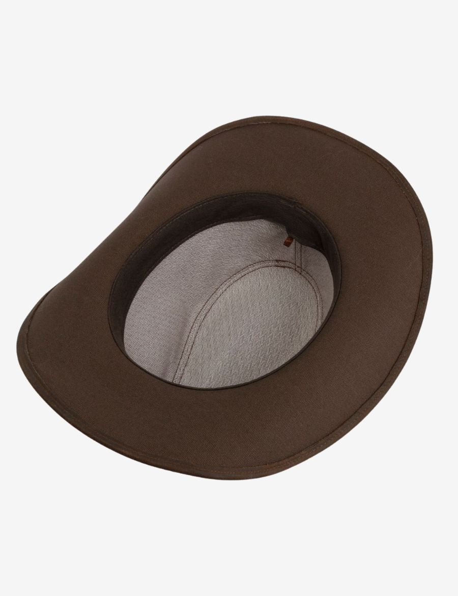 Interior detail of western brown suede leather cowboy hat showing the structured crown, wide brim, and comfort sweatband.
