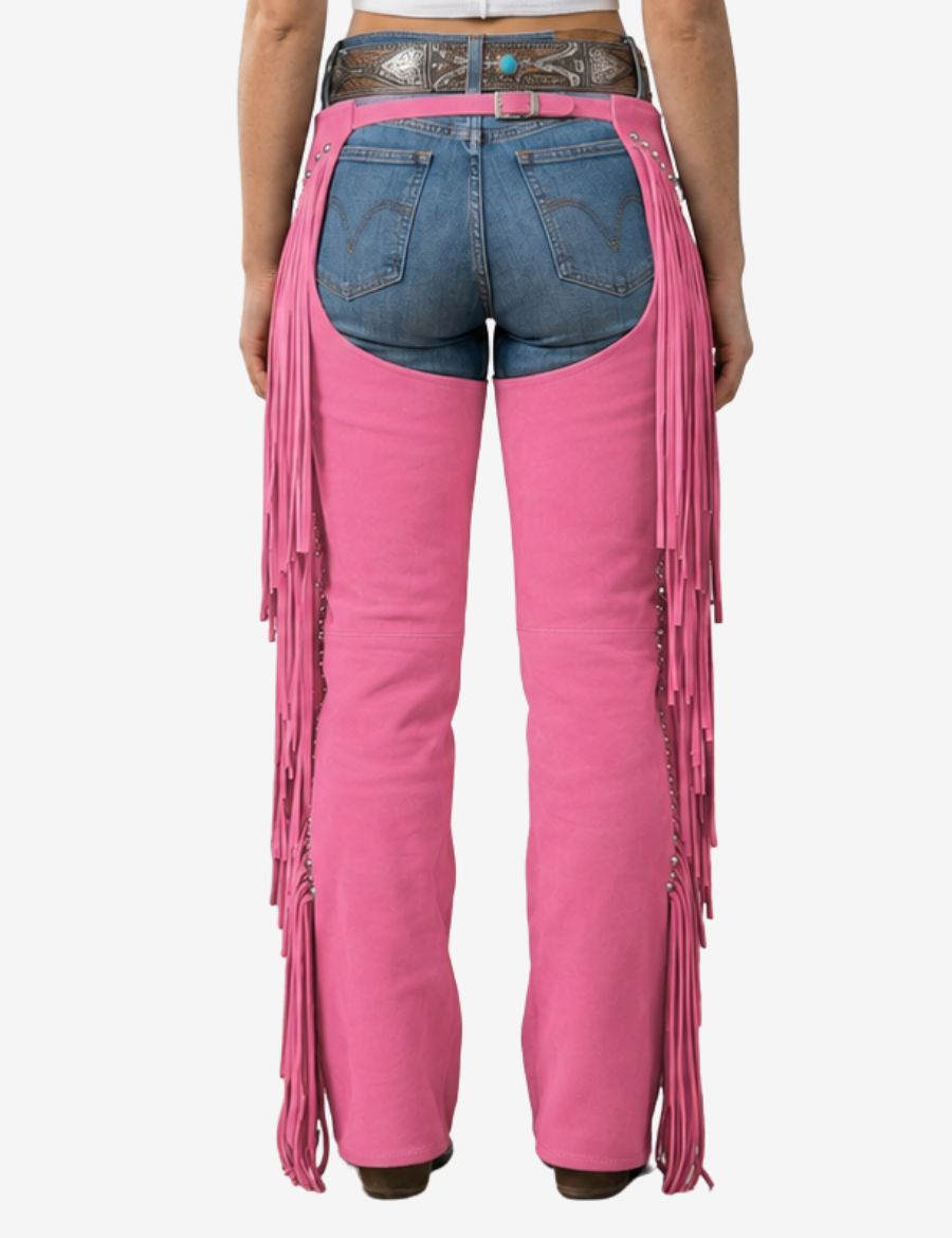 Back view of western embroidered pink cowgirl chaps showcasing long fringe details, stud accents, and premium western craftsmanship.