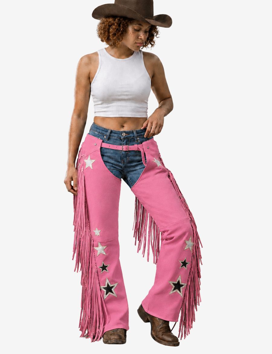 Cowgirl wearing western embroidered pink cowgirl chaps with star appliqués, long fringe accents, and classic rodeo-inspired styling.