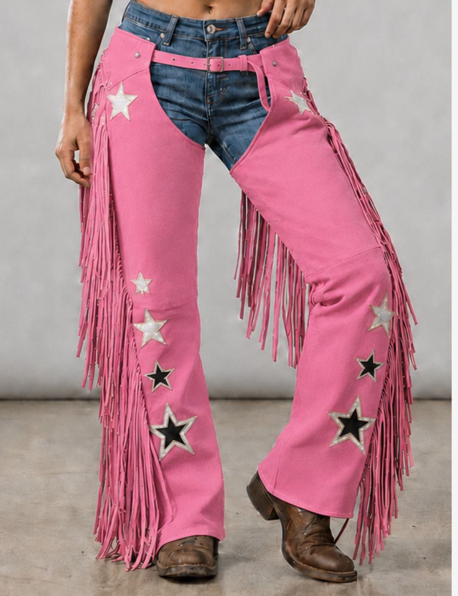 Cowgirl wearing western embroidered pink cowgirl chaps with star appliqués, long fringe accents, and classic rodeo-inspired styling.