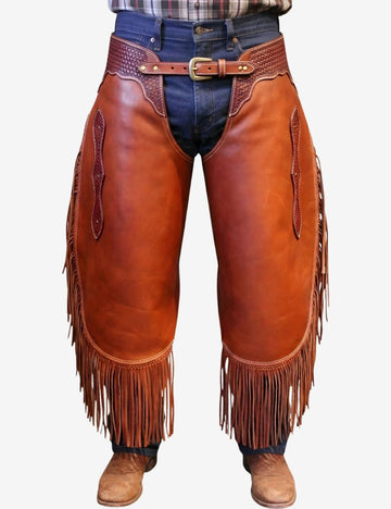 Shop western heritage trim chinks chaps with premium brown leather, hand-tooled accents, and long fringe for authentic cowboy riding style.