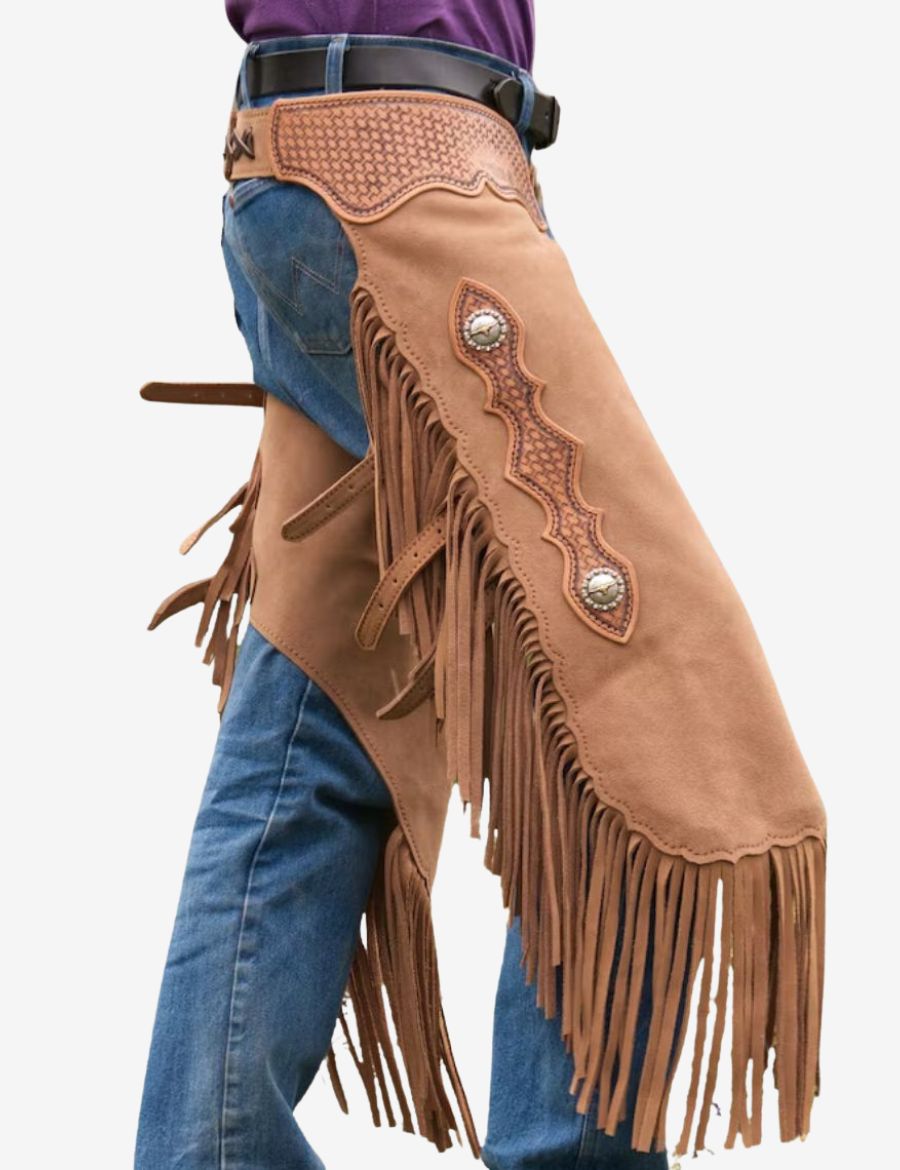 Shop western taupe suede chinks chaps featuring detailed tooling, decorative conchos, and classic western fringe accents.