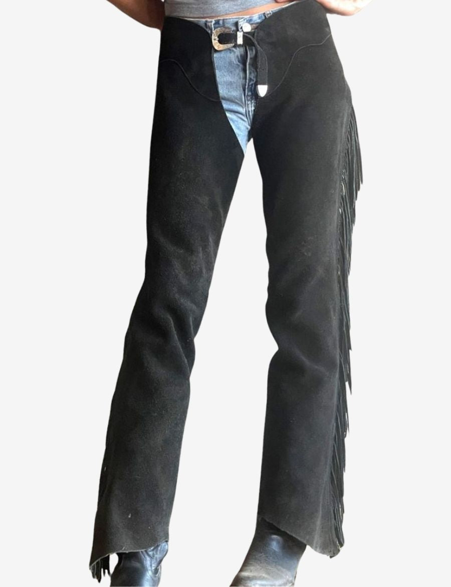 women black western chaps with long leather fringe and classic cowgirl riding styling.