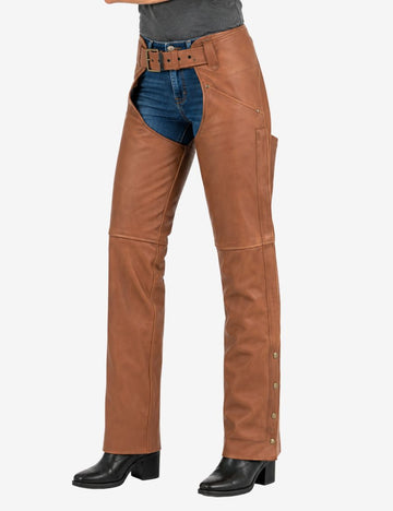 angle view of womens brown leather assless chaps with smooth leather construction, snap-leg closures, and an adjustable buckle waistband.