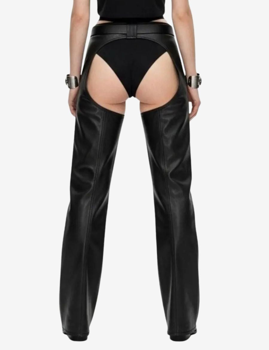 Back view of womens buckled leather buttless chaps showcasing smooth black leather panels, open-back design, tailored fit, and stylish biker-inspired craftsmanship.