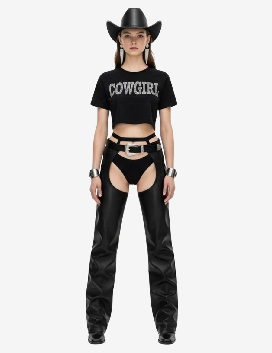 Close-up view of womens buckled leather buttless chaps highlighting the decorative silver buckle, premium black leather construction, and bold open-leg silhouette.