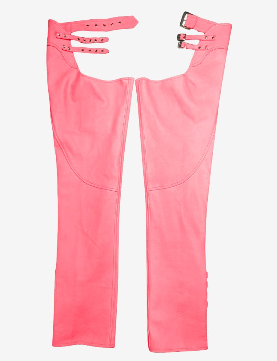 Front view of womens buckled pink assless chaps featuring triple adjustable waist straps, smooth leather construction, and a bold biker-inspired design.