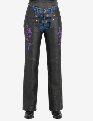 Women's purple embroidered biker chaps in black leather featuring tribal embroidery and dual buckle front closure.
