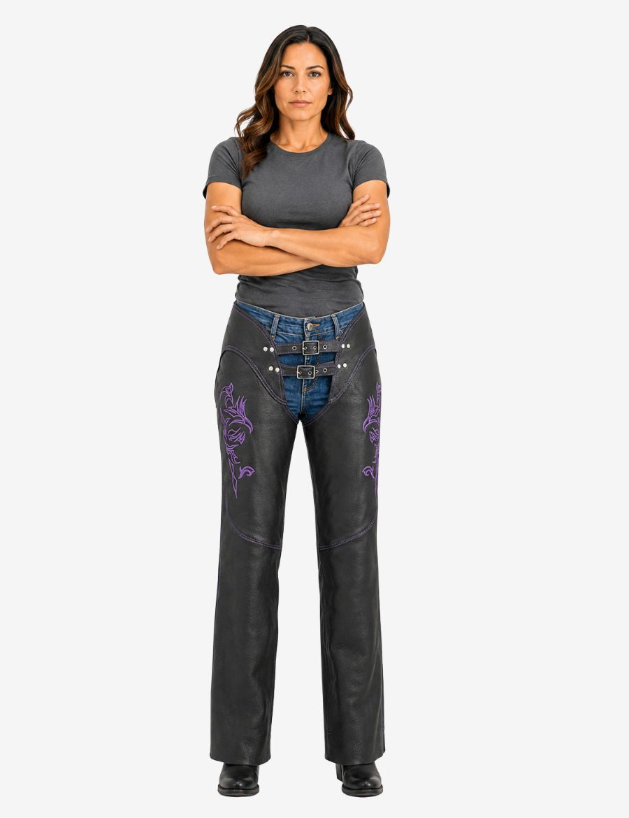 Female model wearing women's purple embroidered biker chaps designed for motorcycle protection and distinctive style.
